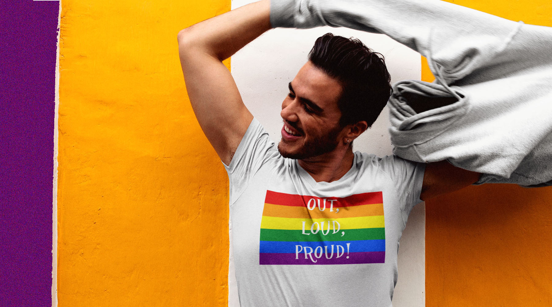 Young Queer Gay Man wearing a Live Out Loud Gay Rainbow Flag T-Shirt